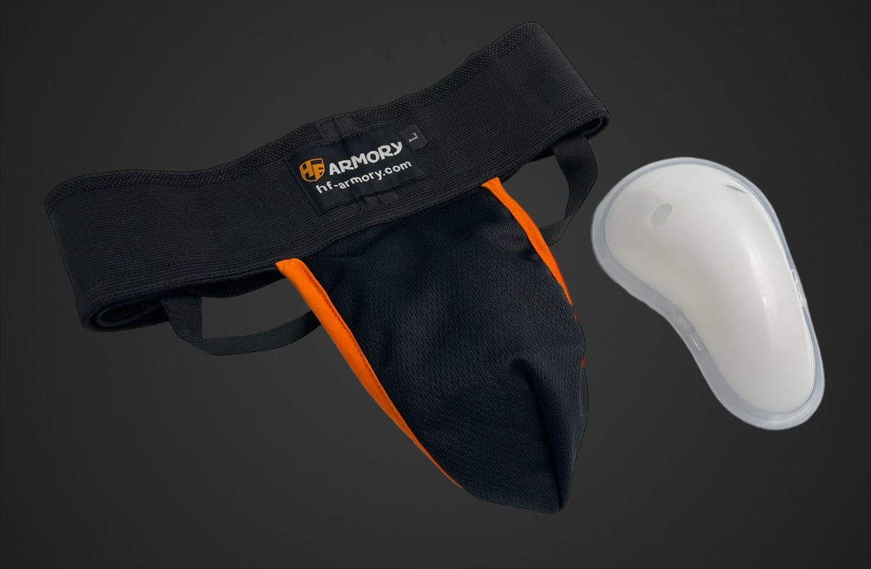 Groin guard with plastic cup