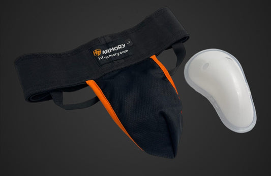 Groin guard with plastic cup